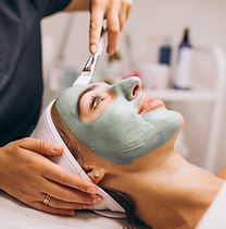 cosmetologist-applying-mask-face-client-beauty-salon (1).jpg