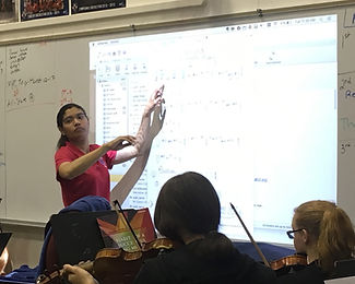 Ms. Wilkins in class, teaching.