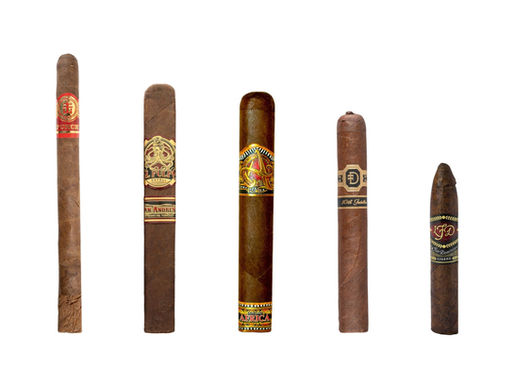 A selection of 5 different cigars on a white background