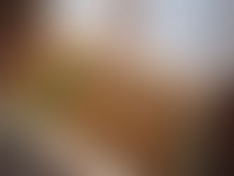 A box of The Wise Man cigars on a cherry wood table