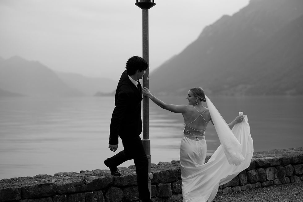 Bride and groom playfully spinning at their adventure elopement in Switzerland.