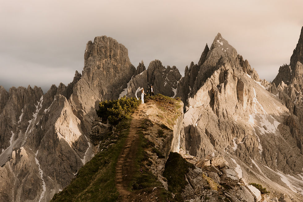 Bride and groom enjoying hiking in one of the best elopement destinations: The Italian Dolomites.