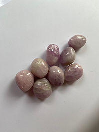 💗✨ KUNZITE ✨💗



🌟 Stone of Divine Love • Emotional Freedom • Inner Peace 🌟

💗 “A gentle light that teaches the heart to remain open and strong.” 💗

“With its delicate shades of blush pink, lilac and soft violet, Kunzite carries a luminous beauty that feels both tender and uplifting. This enchanting variety of Spodumene is traditionally associated with unconditional love, emotional release and peaceful self-expression. Encouraging the heart to soften without surrendering its wisdom, Kunzite reminds us that genuine love should be supported by self-respect, honest communication and healthy emotional boundaries.”

Alternate Stone Names: Pink Spodumene • Lilac Spodumene
Pronunciation: KOON-zite
Crystal Family: Spodumene • Pyroxene Group
Chemical Formula: LiAlSi₂O₆
Crystal System: Monoclinic
Mohs Hardness: 6.5–7
Primary Source Locations: Afghanistan • Brazil • Madagascar • Pakistan • USA • Myanmar • Nigeria
Typical Colours: Pale Pink • Blush • Lilac • Violet-Pink • Nearly Colourless
Planetary Influence: Venus • Moon
Element: Water • Air
Numerical Vibration: 7

💗✨ Crystal Essence & Spiritual Meaning ✨💗

Kunzite is a gentle yet emotionally strengthening crystal traditionally associated with love, compassion and freedom from fear.

Its soft pink and lilac colouring symbolises a heart that remains open while becoming wiser and more discerning. It is often chosen during periods of emotional healing, relationship change or renewed self-discovery.

Kunzite does not represent love without limits. Instead, it encourages affection supported by self-respect, honest communication and healthy emotional boundaries.

It is traditionally associated with:
Unconditional love
Emotional freedom
Inner peace
Compassion
Self-acceptance
Heartfelt communication
Spiritual awareness
Emotional courage
Gentleness
Personal renewal

🌺✨ Meaning & Symbolism ✨🌺

Kunzite symbolises the courage to love without losing connection with the self.

Traditionally, it is believed to encourage:
Releasing fear surrounding love
Softening emotional defensiveness
Developing greater self-compassion
Expressing affection openly
Letting go of past disappointment
Creating healthier emotional boundaries
Recognising personal emotional needs
Welcoming joy after difficult experiences

Kunzite reminds us that sensitivity is not weakness. A gentle heart may still possess strong judgement, clear boundaries and the courage to walk away from what causes repeated harm.

Its energy encourages love that feels peaceful, respectful and emotionally honest.

💗✨ Core Energies & Metaphysical Properties ✨💗

Kunzite is traditionally regarded as a high-vibration heart stone associated with emotional healing, divine love and spiritual connection.

Its core energies are commonly associated with:
Love
Compassion
Emotional release
Inner peace
Self-worth
Forgiveness
Spiritual awareness
Healthy relationships
Emotional resilience
Gentle communication
Joy
Personal transformation

It may be especially meaningful for those who have become emotionally guarded following disappointment, grief or repeated conflict.

Kunzite encourages gradual openness rather than emotional pressure. Its symbolism allows healing to unfold at a pace that feels safe and manageable.

👁️✨ Chakra Alignment & Energy Flow ✨👁️

💚 Heart Chakra:
Kunzite has its strongest connection with the Heart Chakra, where it is traditionally believed to encourage compassion, emotional openness and self-acceptance.

It may symbolically support:
Release of old emotional pain
Greater capacity to receive love
Compassion towards the self
Healing after relationship difficulties
Forgiveness without abandoning boundaries
Renewed trust in emotional connection

💗 Higher Heart Chakra:
Modern crystal traditions also connect Kunzite with the Higher Heart Chakra, associated with unconditional love, empathy and spiritual compassion.

🩵 Throat Chakra:
Its pale lilac tones may resonate with the Throat Chakra by encouraging calm expression of feelings and emotional needs.

👑 Crown Chakra:
Kunzite’s violet colouring also links it with the Crown Chakra, where it is associated with spiritual love, higher understanding and connection with divine wisdom.

Together, these associations represent love that is felt deeply, expressed honestly and guided by spiritual awareness.

🌸✨ Crystal Colour Meaning ✨🌸

Kunzite ranges from nearly colourless pink to stronger shades of lilac and violet.

Pale-Pink Energy:
Gentleness
Self-love
Emotional reassurance
Compassion

Blush-Pink Energy:
Affection
Emotional renewal
Tenderness
Hope

Lilac Energy:
Spiritual awareness
Intuition
Grace
Emotional transformation

Violet-Pink Energy:
Divine love
Higher wisdom
Inner freedom
Spiritual connection

Colourless Areas:
Clarity
Truth
Openness
New potential

Kunzite is strongly pleochroic, meaning it may display different colour intensity when viewed from different directions. This changing appearance symbolically reflects the many perspectives and emotional layers that may exist within one experience.

🌿✨ Emotional & Mental Wellbeing ✨🌿

Within crystal healing traditions, Kunzite is valued for its gentle, reassuring and emotionally liberating character.

It has traditionally been associated with supporting:
Emotional balance
Release of fear
Self-compassion
Recovery after disappointment
Healthy emotional boundaries
Freedom from excessive self-criticism
Calm communication
Greater openness to affection
Release of emotional tension
Acceptance of personal sensitivity
Inner peace
Renewed enjoyment of life

Kunzite may be especially meaningful when past experiences have created fear around closeness, vulnerability or trust.

Its symbolism encourages reflection upon questions such as:
What am I protecting my heart from?
Does this boundary support me or isolate me?
Am I accepting less than I deserve through fear of being alone?
Can I receive love without feeling guilty or suspicious?
What would emotional safety look like for me?

Kunzite encourages openness without emotional self-abandonment. Love should not require silence, fear or the repeated sacrifice of personal wellbeing.

💪🌿 Physical Healing Associations 🌿💪

The practices described in this section belong to traditional and modern crystal healing traditions and are presented for educational interest. Crystals should never be used as substitutes for professional medical advice, diagnosis or treatment. Anyone experiencing persistent physical symptoms, anxiety, depression or emotional distress should seek guidance from an appropriately qualified healthcare professional.

Within contemporary crystal practice, Kunzite has traditionally been associated with:
Relaxation during emotional stress
Restful sleep traditions
General nervous system calm
Heart-centred wellbeing intentions
Physical relaxation
Recovery from emotional fatigue
General vitality
Healthy breathing and mindfulness practices

Some metaphysical sources also connect Kunzite with circulation, hormonal balance and physical recovery. These associations are symbolic and are not supported by reliable clinical evidence.

Kunzite should not be described as preventing, diagnosing, treating or curing any medical condition.

🌍✨ Geological Formation & Mineral Information ✨🌍

Kunzite is the pink-to-lilac gem variety of Spodumene, a lithium aluminium silicate mineral belonging to the Pyroxene Group.

Its chemical formula is LiAlSi₂O₆, and it crystallises in the monoclinic system. Spodumene has a Mohs hardness of approximately 6.5–7 but is brittle and possesses strong cleavage, meaning it may split or chip despite its apparent hardness.

Kunzite typically forms within lithium-rich granite pegmatites, where slowly cooling mineral-rich fluids allow large crystals to develop.

It may occur alongside:
Quartz
Albite
Microcline
Lepidolite
Tourmaline
Beryl
Morganite
Other lithium-bearing minerals

Kunzite commonly appears as:
Long prismatic crystals
Flattened blades
Strongly striated crystals
Transparent faceted gemstones
Cabochons
Tumbled pieces
Raw mineral specimens
Jewellery

Its pink and violet colouring is associated primarily with manganese within the crystal structure. Natural colour may be pale, and some material is irradiated to intensify its appearance.

Important sources include Afghanistan, Brazil, Madagascar, Pakistan, California in the United States, Myanmar and Nigeria.

Afghanistan is particularly known for producing transparent lilac and pink crystals, while Brazil and Madagascar have supplied significant gem material.

Kunzite may display strong pleochroism, appearing more intensely coloured in one direction and paler or nearly colourless in another. Skilled cutters orient gemstones carefully to reveal the strongest colour.

🏺✨ History & Sacred Traditions ✨🏺

Kunzite is a comparatively modern gemstone and does not possess the extensive ancient history sometimes attributed to older stones such as Lapis Lazuli or Malachite.

The mineral Spodumene was already known, but the transparent lilac-pink gem variety was brought to attention following discoveries near Pala, California.

It was described in 1903 and named Kunzite in honour of George Frederick Kunz, the American mineralogist, gem expert and author associated with Tiffany & Co.

Its early appeal came from:
Its delicate pink-to-violet colour
Its exceptional transparency
Its large crystal sizes
Its strong pleochroism
Its association with modern gem discovery

Because Kunzite entered the gem market during the early twentieth century, most of its spiritual meanings developed within modern crystal traditions.

It became associated with:
Romantic and unconditional love
Emotional healing
Peace
Self-compassion
Spiritual awareness
Heartfelt communication
Release of fear
Emotional renewal

Its modern history does not lessen its symbolic value, but claims of ancient Kunzite rituals or historic civilisations using the named gemstone should be approached cautiously.

💗👑 Divine & Spiritual Associations 👑💗

Kunzite may be symbolically connected with divine figures associated with love, compassion, peace and emotional renewal.

Modern spiritual correspondences may include:
Aphrodite – Greek goddess associated with love and beauty
Venus – Roman goddess associated with affection, harmony and relationships
Kuan Yin – Buddhist figure associated with compassion and mercy
Mary – associated within some modern spiritual practices with maternal love and gentleness
Aine – Irish goddess associated with love, light and sovereignty

These are modern symbolic correspondences rather than evidence that Kunzite was historically used within the worship of these figures.

They reflect its contemporary associations with compassion, emotional openness and spiritually guided love.

🏡✨ Feng Shui ✨🏡

In Feng Shui-inspired crystal practice, Kunzite combines the emotional flow of Water with the softness and harmony traditionally associated with gentle Fire and Earth energy.

It is traditionally placed in:
Bedrooms
Relationship areas
Meditation spaces
Living rooms
Healing rooms
Self-care areas
Children’s rooms
Quiet reflection spaces

Placed in the Southwest or Relationship area, Kunzite may symbolically encourage mutual compassion, honest affection and emotional balance.

Placed in a bedroom, its soft colour may contribute to an atmosphere of peace, tenderness and emotional safety.

Placed in a self-care or meditation area, it may support reflection upon personal needs, boundaries and emotional wellbeing.

Placed in a family space, Kunzite may symbolically encourage calmer communication and greater sensitivity towards the feelings of others.

Because direct sunlight can fade its colour, it should not be displayed permanently in a bright sunny window.

🔮🧿 Divination & Talismanic Power 🧿🔮

💗 Divinatory Meaning
“Allow your heart to soften without surrendering your wisdom. Love that is right for you will honour your truth and your boundaries.”

Kunzite is regarded within modern crystal practice as a talisman of emotional freedom, compassion and peaceful love.

Its talismanic qualities are associated with:

Heart-Healing Energy:
Supports emotional release
Encourages self-compassion
Promotes forgiveness
Helps restore trust gradually

Peace-Bringing Energy:
Encourages emotional calm
Supports gentle communication
Promotes the release of tension
Helps create a sense of safety

Boundary Energy:
Encourages love without self-sacrifice
Supports emotional discernment
Promotes healthier relationships
Helps sensitivity remain protected

Divine-Love Energy:
Supports spiritual reflection
Encourages compassion
Promotes awareness of interconnectedness
Strengthens the relationship between love and wisdom

Kunzite may be carried during emotional transitions, relationship healing, counselling, meditation or periods when the heart needs reassurance and renewed hope.

♏💗 Zodiac & Astrological Resonance ♉💗

Primary Zodiac: Scorpio
Secondary Resonance: Taurus • Libra • Pisces
Planetary Influence: Venus • Moon
Elemental Influence: Water • Air

Kunzite’s association with emotional depth, release and transformation resonates strongly with Scorpio.

Its connection with Venus, affection and sensory beauty complements Taurus, while its themes of harmony and loving communication may appeal to Libra.

Its sensitivity, compassion and spiritual character may also resonate with Pisces.

Water represents emotion, intuition and healing, while Air supports communication, perspective and emotional freedom.

🧼✨ Cleansing, Charging & Care ✨🧼

Kunzite is traditionally cleansed using:
Moonlight
Smoke cleansing
Sound cleansing
Selenite
Breath and visualisation
A soft, dry cloth

It is commonly used for:
Heart Chakra meditation
Higher Heart practices
Self-love rituals
Emotional-release work
Relationship reflection
Calm communication
Grief support rituals
Spiritual contemplation
Boundary-setting intentions
Affirmation work

Kunzite may also be paired with:
Rose Quartz for self-love and emotional comfort
Morganite for compassion and relationship harmony
Pink Opal for emotional reassurance
Amethyst for peace and spiritual awareness
Black Tourmaline for grounding and boundaries
Clear Quartz for clarity and focused intention
Lepidolite for calm during emotional change

Care: Kunzite has a hardness of approximately 6.5–7, but it is brittle and has perfect cleavage. It may chip, crack or split if struck or exposed to sudden pressure.

Its colour may fade with prolonged exposure to strong sunlight or heat, which is why Kunzite is sometimes described as an “evening stone.” Irradiated colour may be particularly vulnerable to fading.

Avoid:
Prolonged direct sunlight
Strong heat
Steam cleaning
Ultrasonic cleaners
Sudden temperature changes
Harsh chemicals
Strong impacts

Clean Kunzite gently using lukewarm water, mild soap and a very soft cloth or brush. Rinse briefly and dry carefully.

Store it separately from harder gemstones and avoid wearing Kunzite jewellery during manual work, exercise or activities where it may be knocked.

🌟💗 Affirmation 💗🌟
✨ “I open my heart with courage and wisdom. I welcome love, honour my boundaries and allow peace to guide my emotional journey.” ✨