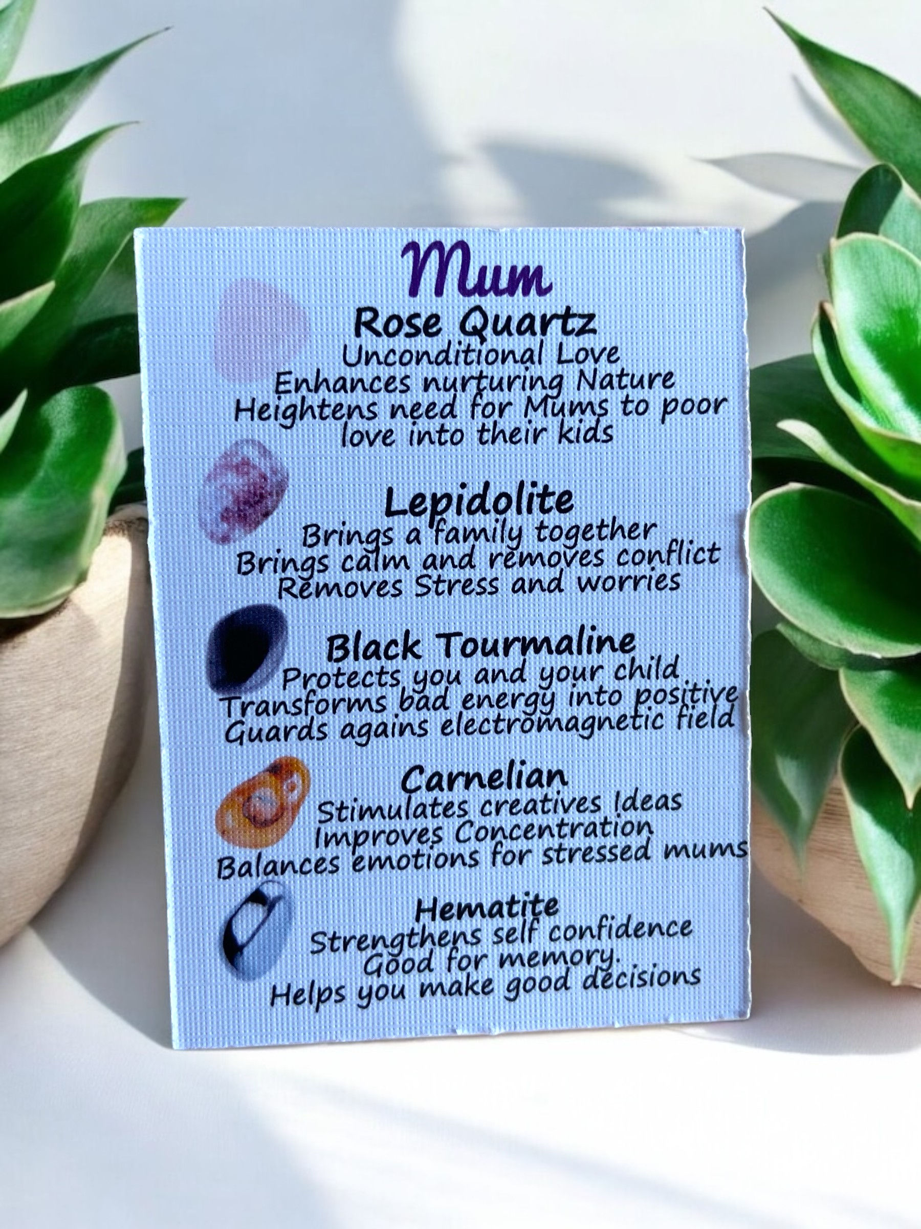 An information card from the Mum's Crystal Set displayed on a wooden tabletop,