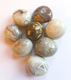 🌈 AGATE - CRAZY LACE

The Stone of Joy, Optimism & Playful Transformation

“With its joyful swirls of cream, gold, scarlet, brown, grey and black, Crazy Lace Agate appears to dance with movement and personality. Its twisting bands reflect the unexpected turns of life, reminding us that beauty is often found within experiences that do not follow a perfectly straight path. Traditionally known as the Laughter Stone, it encourages optimism, emotional resilience and the freedom to meet life with curiosity, humour and an open heart.”

INTRODUCTION

🌟 Stone of Joy • Optimism • Playful Transformation 🌟

🌈 “I welcome the joy woven through every part of my journey.” 🌈

Alternate Names: Mexican Crazy Lace Agate • Happy Lace • Laughter Stone
Pronunciation: KRAY-zee lays AG-it
Crystal Family: Quartz • Chalcedony • Agate
Chemical Formula: SiO₂
Crystal Structure: Microcrystalline • Trigonal Quartz Components
Mohs Hardness: 6.5–7
Primary Source Location: Chihuahua • Northern Mexico
Typical Colours: Cream • White • Yellow • Gold • Red • Orange • Brown • Grey • Black
Planetary Influence: Mercury • Sun
Element: Earth • Fire
Numerical Vibration: 7

🌈✨ Crystal Essence & Spiritual Meaning ✨🌈

Crazy Lace Agate is a lively and uplifting stone traditionally associated with joy, emotional resilience and positive transformation. Its energetic patterns symbolise movement, freedom and the ability to find new possibilities within unexpected circumstances.
Rather than encouraging seriousness or emotional heaviness, its playful character reminds us that healing may also include laughter, creativity and moments of genuine enjoyment.

It is traditionally associated with:
Joy
Optimism
Emotional resilience
Playfulness
Confidence
Transformation
Creative thinking
Positive perspective

🌺✨ Meaning & Symbolism ✨🌺

Crazy Lace Agate symbolises the colourful and unpredictable nature of life. Its twisting bands rarely follow a simple path, reflecting the way personal growth often develops through surprising experiences and changes of direction.
Traditionally, it is believed to encourage:
Finding hope during challenging periods
Viewing problems from a fresh perspective
Releasing bitterness and emotional heaviness
Welcoming laughter and enjoyment
Following an authentic personal path
Adapting when plans unexpectedly change
Recognising beauty within imperfection
It reminds us that joy does not deny life’s difficulties—it can provide the strength needed to move through them.

💗✨ Core Energies & Metaphysical Properties ✨💗

Crazy Lace Agate is traditionally regarded as an energising yet grounding stone. It is believed to lift the emotions while helping scattered energy remain stable and centred.

Its core energies are commonly associated with:
Happiness
Encouragement
Emotional balance
Confidence
Creativity
Mental flexibility
Grounding
Self-acceptance
Motivation
Personal freedom
It may be especially meaningful for those who feel emotionally drained, creatively restricted or overly influenced by the expectations of others.

👁️✨ Chakra Alignment & Energy Flow ✨👁️

❤️ Root Chakra:
Crazy Lace Agate connects with the Root Chakra through its grounding Earth energy, traditionally encouraging stability, security and emotional steadiness.

🧡 Sacral Chakra:
Its orange, red and golden tones resonate with the Sacral Chakra, where it is believed to inspire creativity, pleasure, spontaneity and emotional movement.

👁️ Third Eye Chakra:
Its intricate patterns create a symbolic connection with the Third Eye Chakra, encouraging new perspectives, intuitive awareness and imaginative thinking.

👑 Crown Chakra:
Some crystal traditions also connect Crazy Lace Agate with the Crown Chakra, where it represents spiritual freedom and the confidence to explore a personal path.
Together, these associations symbolise remaining grounded while allowing creativity, insight and joy to flow more freely.

🌸✨ Crystal Colour Meaning ✨🌸

Red Energy:
Courage
Vitality
Action
Strength

Orange and Gold Energy:
Joy
Creativity
Confidence
Enthusiasm

Cream and White Energy:
Clarity
Hope
Peace
Fresh perspective

Brown Energy:
Grounding
Stability
Practicality
Connection with the Earth

Black and Grey Energy:
Protection
Balance
Emotional maturity
Inner strength

Its many colours represent the full range of life’s experiences and the possibility of discovering joy within complexity.

🌿✨ Emotional & Mental Wellbeing ✨🌿

Within crystal healing traditions, Crazy Lace Agate is valued for its cheerful, supportive and emotionally strengthening character. It is often chosen when life feels overly serious, repetitive or emotionally demanding.

It has traditionally been associated with supporting:
A brighter emotional outlook
Recovery from disappointment
Release of bitterness and frustration
Confidence and self-acceptance
Mental flexibility
Creative problem-solving
Emotional resilience
Laughter and social connection
Its lively appearance may serve as a visual reminder to loosen rigid expectations and remain open to unexpected opportunities.

💪🌿 Physical Healing Associations 🌿💪

The practices described in this section belong to traditional and modern crystal healing traditions and are presented for educational interest. Crystals should never replace professional medical advice, diagnosis or treatment.

Within contemporary crystal practice, Crazy Lace Agate has traditionally been associated with:
General vitality
Physical balance and stamina
Digestive wellbeing traditions
Relaxation during stress
Healthy circulation traditions
Restful sleep
Emotional calm during recovery
Support for healthy lifestyle intentions
These symbolic associations should not be interpreted as evidence that Crazy Lace Agate can prevent, diagnose, treat or cure any medical condition.

🌍✨ Geological Formation & Mineral Information ✨🌍

Crazy Lace Agate is a multicoloured, intricately banded variety of Chalcedony within the Quartz family. It is recognised by its twisting, turning and lace-like patterns, which may include cream, red, yellow, brown, grey and black.
Unlike many Agates associated with volcanic cavities, notable Crazy Lace Agate deposits in Chihuahua occur within highly silicified limestone. Mineral-rich fluids gradually deposited silica in complex layers, creating its characteristic swirls and bands.

It is commonly found as:
Tumbled stones
Palm stones
Cabochons
Beads
Jewellery
Polished slabs
Decorative carvings
Collector specimens
Each piece displays a different combination of colours and patterns, contributing to its playful and individual character.

🏺✨ History & Sacred Traditions ✨🏺

Agate has been valued since ancient times for jewellery, seals, amulets and decorative objects. Across several cultures, it became associated with balance, courage, protection and good fortune.
Crazy Lace Agate’s modern identity is particularly connected with Mexico and the joyful symbolism of music, movement, celebration and colourful festivals.
Its swirling patterns have inspired associations with:
Laughter
Dancing
Freedom
Friendship
Transformation
The colourful web of life
The title Laughter Stone reflects its modern reputation as a companion for those seeking optimism, encouragement and a more joyful relationship with life.

🏡✨ Feng Shui ✨🏡

In Feng Shui-inspired crystal practice, Crazy Lace Agate combines grounding Earth energy with the warmth and enthusiasm of Fire.
It is traditionally placed in:
Living rooms
Family areas
Creative studios
Social spaces
Home offices
Children’s play areas
Meditation space
Placed in a shared room, it is believed to encourage warmth, laughter and positive connection.
Placed in a creative space, it may symbolically support imagination, experimentation and freedom from perfectionism.
Placed in a workspace, it can act as a reminder to remain flexible and approach challenges with curiosity rather than frustration.

🔮🧿 Divination & Talismanic Power 🧿🔮

🌈 Divinatory Meaning

“Life does not need to follow a perfect pattern. Welcome the unexpected path and allow joy to guide your next step.”
Crazy Lace Agate is traditionally regarded as a talisman of happiness, encouragement and emotional resilience.

Its symbolic talismanic qualities include:
Joyful Energy
Encourages laughter and optimism
Restores enthusiasm
Supports social connection
Promotes light-hearted reflection
Transforming Energy
Encourages adaptability
Supports fresh perspectives
Helps release limiting expectations
Inspires confidence in a personal path
It may be carried during social gatherings, creative projects, life transitions or periods when a more hopeful perspective is needed.

♊🌈 Zodiac & Astrological Resonance ♌🌈

Primary Zodiac: Gemini
Secondary Resonance: Leo • Sagittarius
Planetary Influence: Mercury • Sun
Elemental Influence: Earth • Fire

Its lively movement and mental flexibility resonate strongly with Gemini.
Its joyful, expressive energy complements Leo, while its adventurous and optimistic character may appeal to Sagittarius.

🧼✨ Cleansing, Charging & Care ✨🧼

Crazy Lace Agate is traditionally cleansed using:
Moonlight
Smoke cleansing
Sound cleansing
Selenite
Brief rinsing with clean water
Earth-based cleansing

It is commonly used for:
Joy and gratitude practices
Creative intentions
Social-confidence work
Grounding meditation
Emotional renewal
Positive affirmations
New projects
Personal transformation

Care: Crazy Lace Agate is relatively durable but may chip or fracture if dropped or struck.
Clean it gently with lukewarm water and a soft cloth. Avoid harsh chemicals, abrasive cleaners and sudden temperature changes. Prolonged soaking is unnecessary, and continuous strong sunlight should be avoided when the stone’s treatment is unknown.

🌟🌈 Affirmation 🌈🌟
✨ “I embrace the joy woven through my life’s patterns. I am free to laugh, create, love and follow my own path with confidence.” ✨