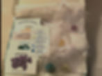 Thumbnail: Manifestation Crystal Box Set with crystals in organza bags, info cards and a briefing card in a letterbox‑size box.