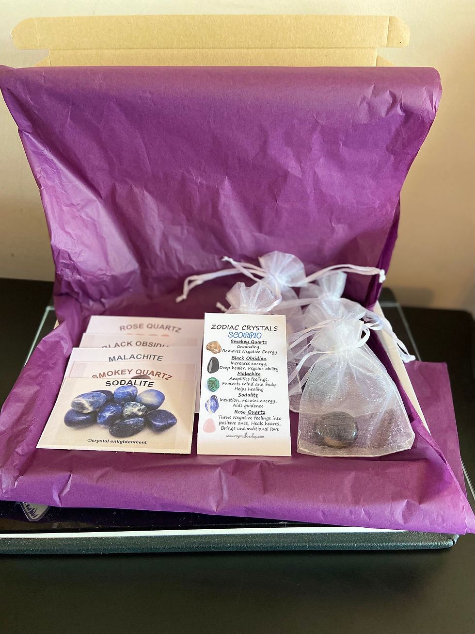 Thumbnail: Releasing Anger Crystal Set with crystals in organza bags, info cards and a briefing card in a postable box.