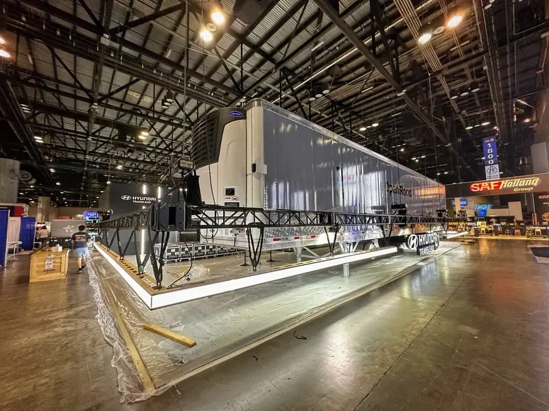 Hyundai Translead trailer showcase inside large trade show booth environment at TMC exhibition