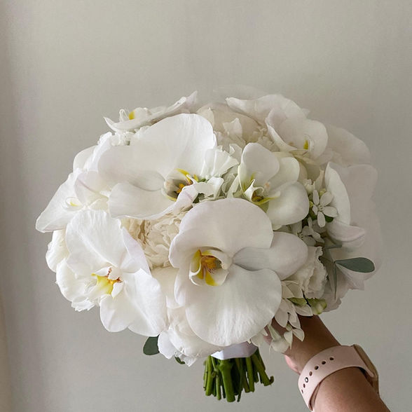 white orchid, roses, hydrangeas packed style wedding flowers 