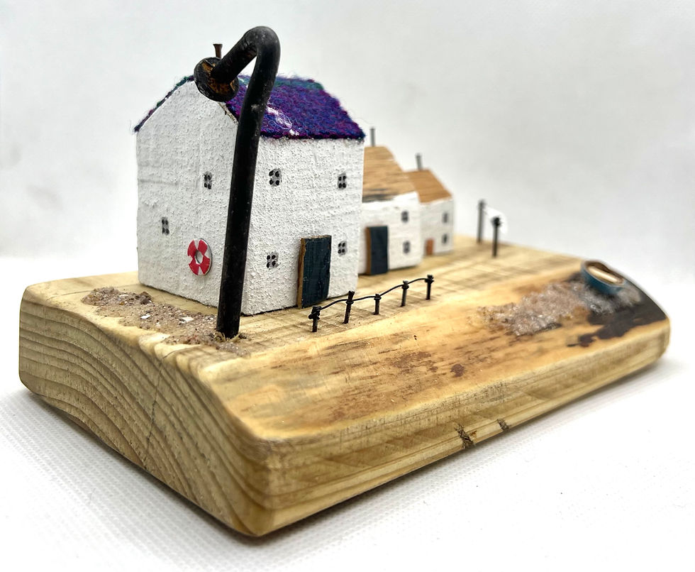 Thumbnail: Wee terrace of driftwood houses