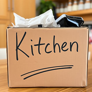 cardboard box with Kitchen written on it in black marker pen.jpg