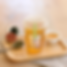 Honey Osmanthus Tea on a Wooden Tray with a Spoon of Tea Leaves
