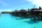 A beautiful overwater resort with villas perched above the stunning turquoise water, offering lovely views in semporna