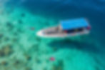 A boat sets off for a daily snorkelling adventure in Semporna.