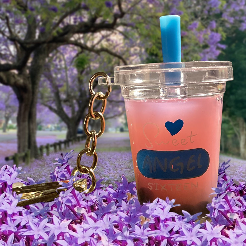 pink strawberry tea boba liquid keychain with straw and yellow keyring