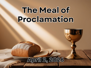 A communion meal of bread and wine set out on a table with a ray of light streaming in.