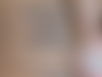 A woman's hands holding a piece of paper that reads "give."