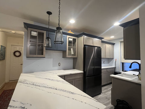 Full kitchen remodel with white quartz counters, gray cabinets