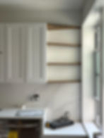 Kitchen renovation with white cabinets and open shelves