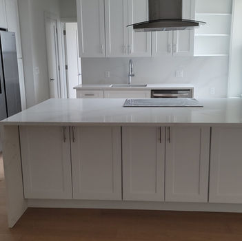 Modern kitchen with white island and cabinets