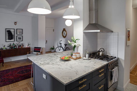 Modern kitchen island with stove and open living space