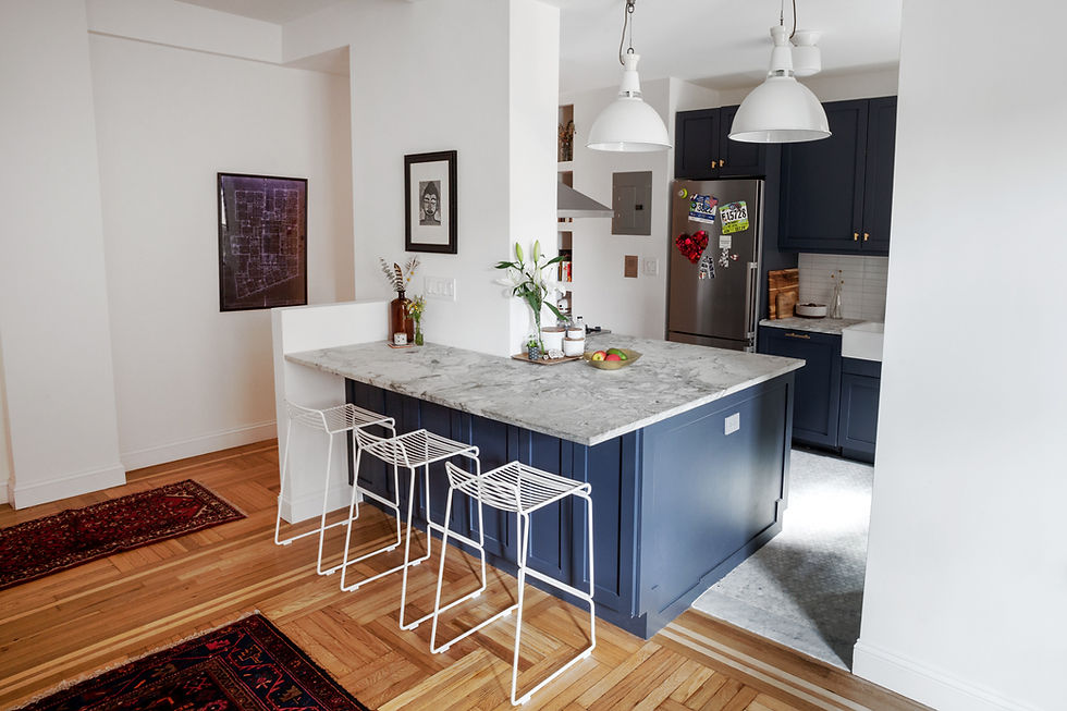 Eye-level view of a modern kitchen under renovation with new cabinets being installed