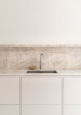 Taj Mahal Quartzite on Skimming Stone handmade kitchen by justustjebbo