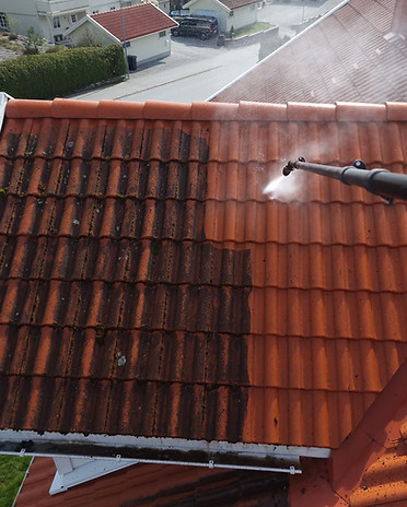 cleaning a roof with a pressure washer.jpg