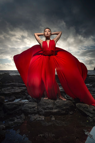 Lady walking in a red flying dress