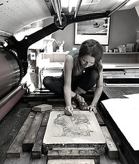 Kate McCrickard adding to her drawing on stone on the Voirin Press