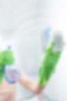 woman-cleaning-window-pane-with-detergent-cleaning-concept.jpg