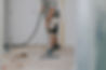 young-man-vacuums-floor-with-construction-vacuum-cleaner.jpg