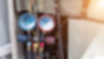 air-conditioner-technician-checks-operation-industrial-air-conditioners.jpg