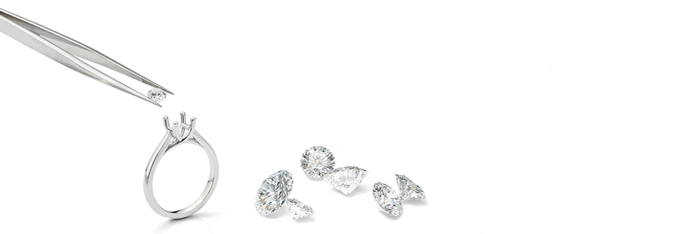 Jewelry pieces and diamonds being set up