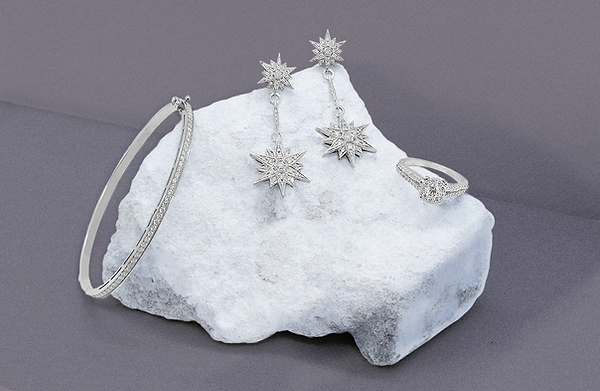 Kalman diamond jewelry with GIA certificate exposed on top of a stone