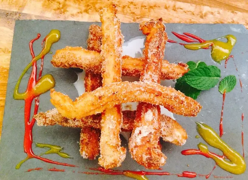 Churros, churros, one of the most pop Mex dessert, mango culis and strawberry sauce and co