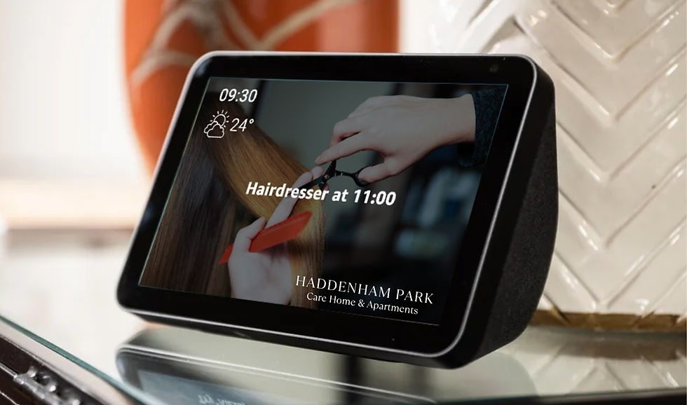 Alexa Show 5 has a smart display on table shows 09:30, weather 24°C, "Hairdresser at 11:00." Hair cutting image, Haddenham Park text visible. Neutral mood.