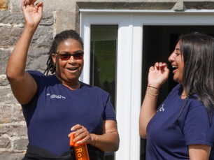 Team members cheer joyfully.