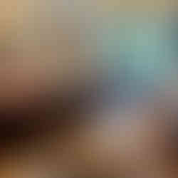 Living area depicts group mingling with hot drinks