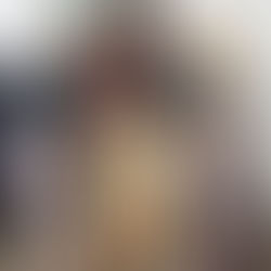 2 female stylists working on styling the model