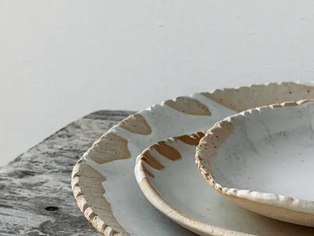 Handmade ceramic white plates with an organic rim