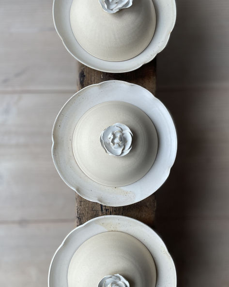 Handmade ceramic plates with cloche lids for restaurant collaboration