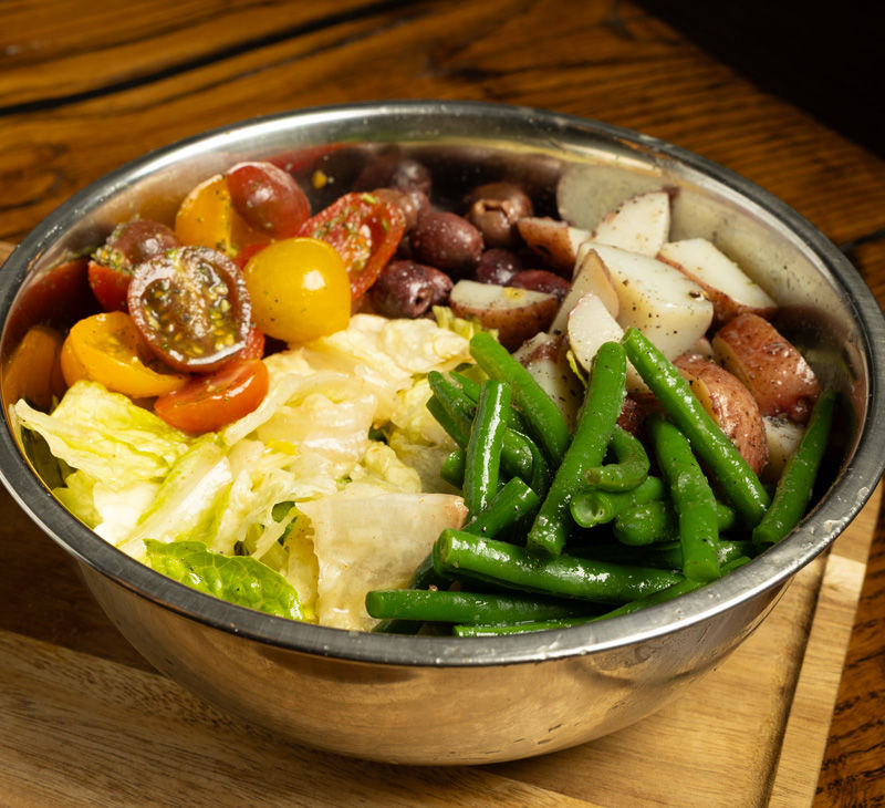 a close up of a Nicoise salad
