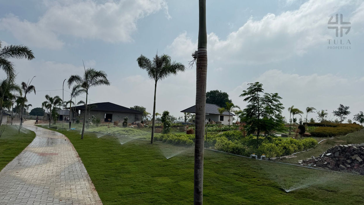 "Aerial perspective of Rhythms of Earth's expansive 15-acre resort, highlighting lush landscapes and modern facilities."