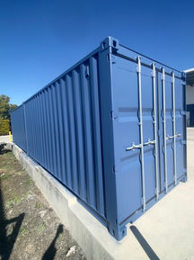 Office, workplace, industrial, reception, stair case, dark colours, contrasting colours, shipping container, marketing, ideas, creativity