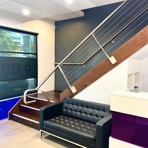 Office, workplace, industrial, reception, stair case, dark colours, contrasting colours, plant