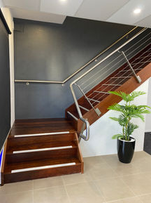 Office, workplace, industrial, reception, stair case, dark colours, contrasting colours, plant