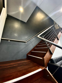 Office, workplace, industrial, reception, stair case, dark colours, contrasting colours, plant