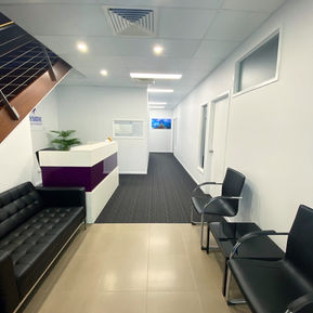 Office, workplace, industrial, reception, stair case, dark colours, contrasting colours, plant