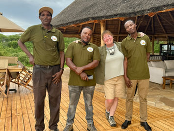 Conservation photographer Kasey Mueller with the Tarangire Lion Project team on a field project in Africa.